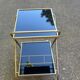 Mid-Century 1978 brass and black smoked glass wheeled dessert trolley.