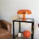 Orange nessino pose lamp for artemide by giancarlo mattioli