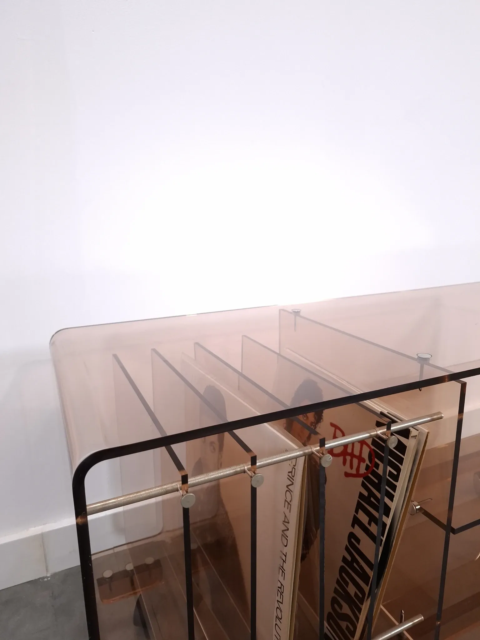Vintage hifi, LP cabinet, TV unit made of tinted plexiglass on wheels, records.