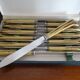 12 Art Deco knives stainless steel and bone 1930 in case