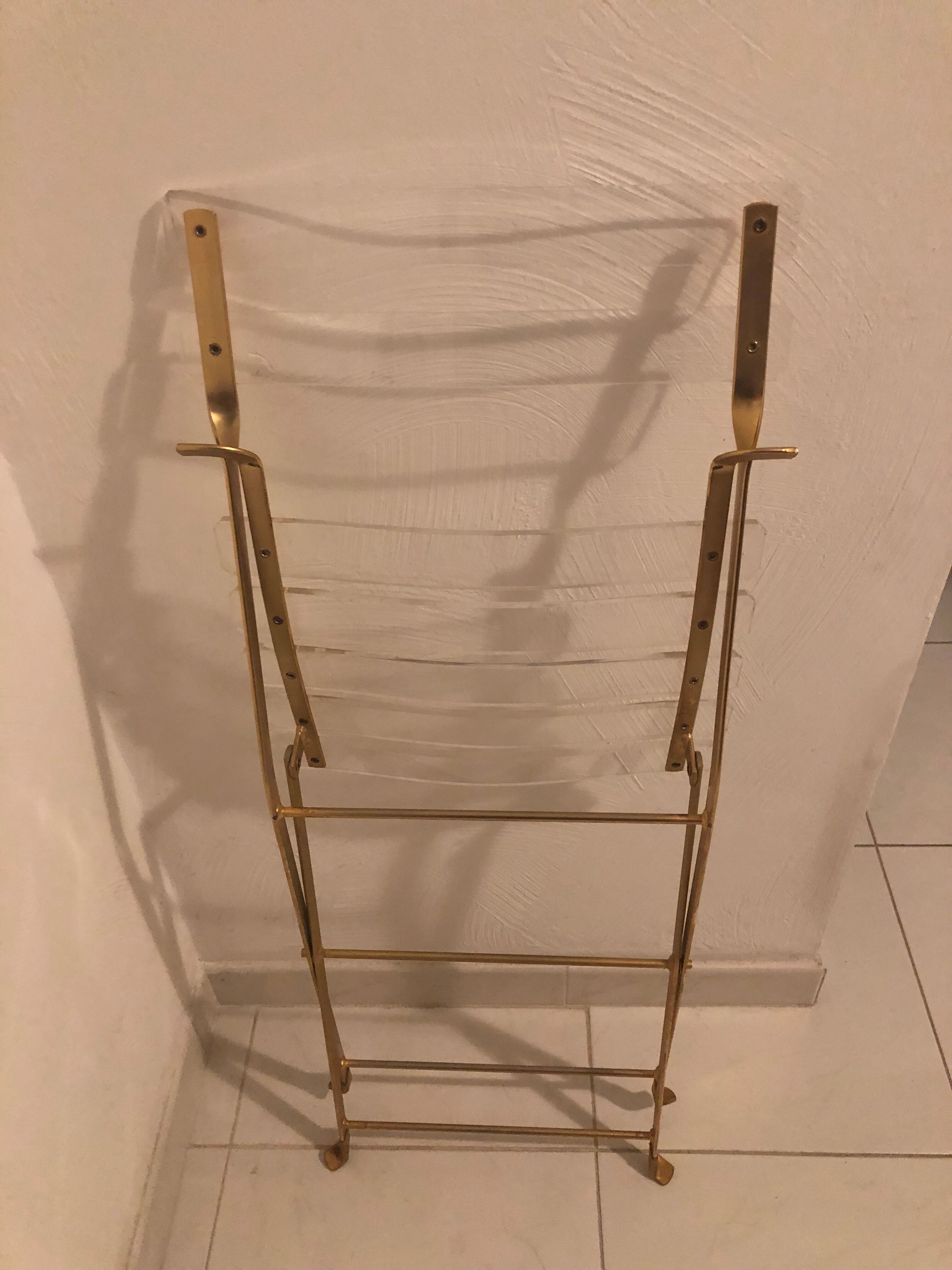 Folding chair in plexiglass and brass