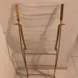 Folding chair in plexiglass and brass