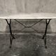 Oval bistro table in white marble with a black cast iron base - 120 cm