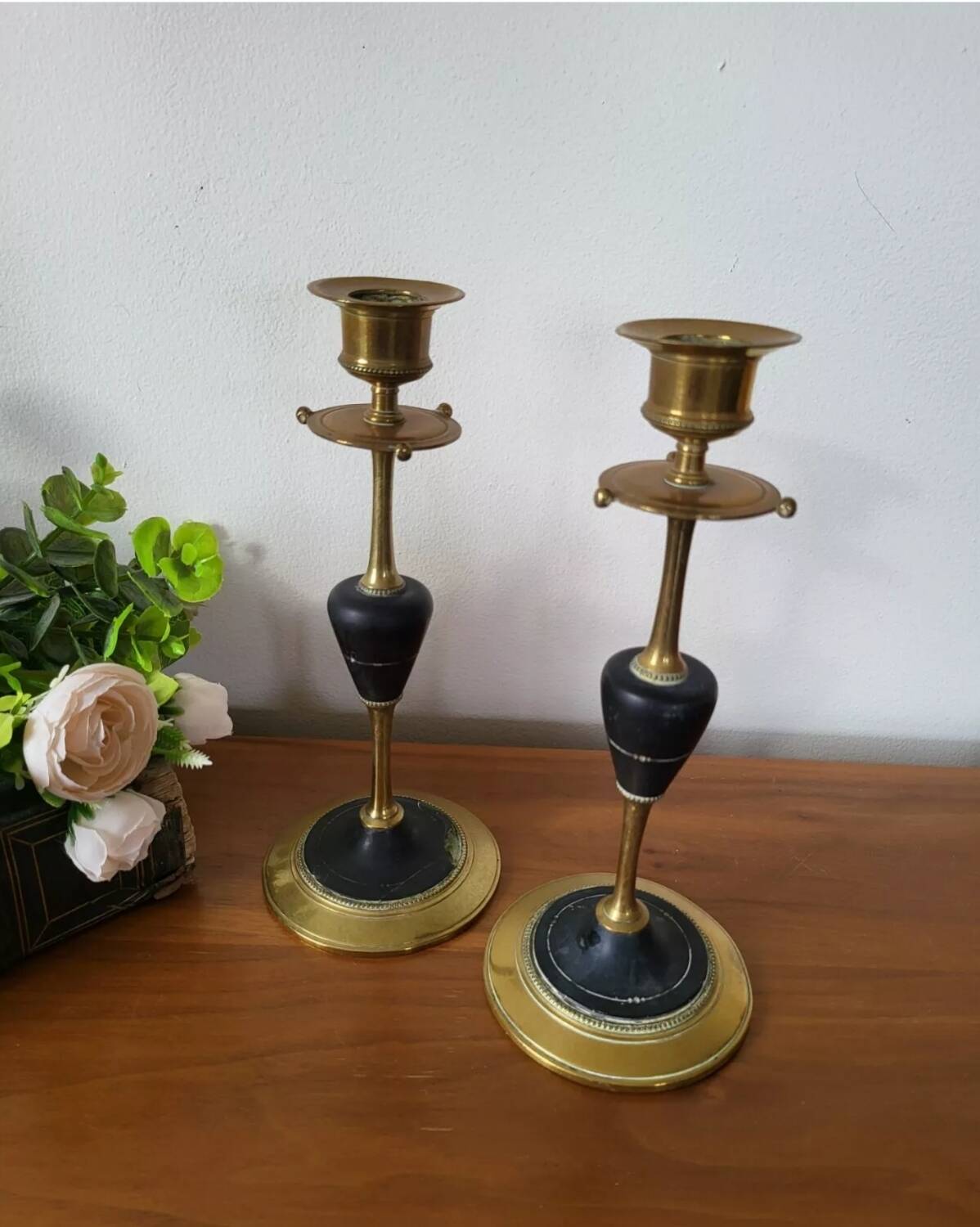 Pair of brass and black hard stone candlesticks