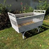 Vintage wicker bed with casters from the 50s in perfect condition