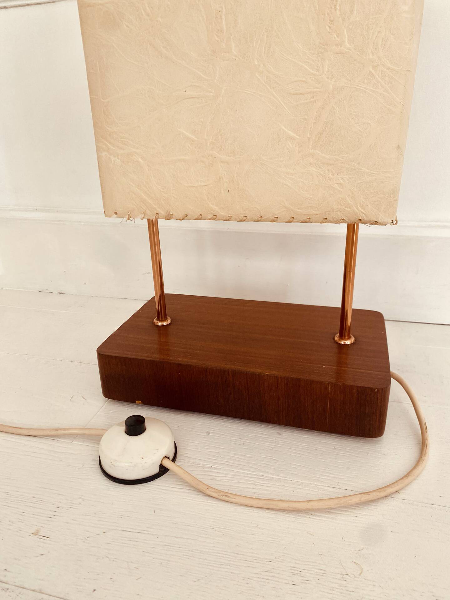 Wood and copper metal floor lamp with parchment.