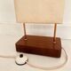 Wood and copper metal floor lamp with parchment.