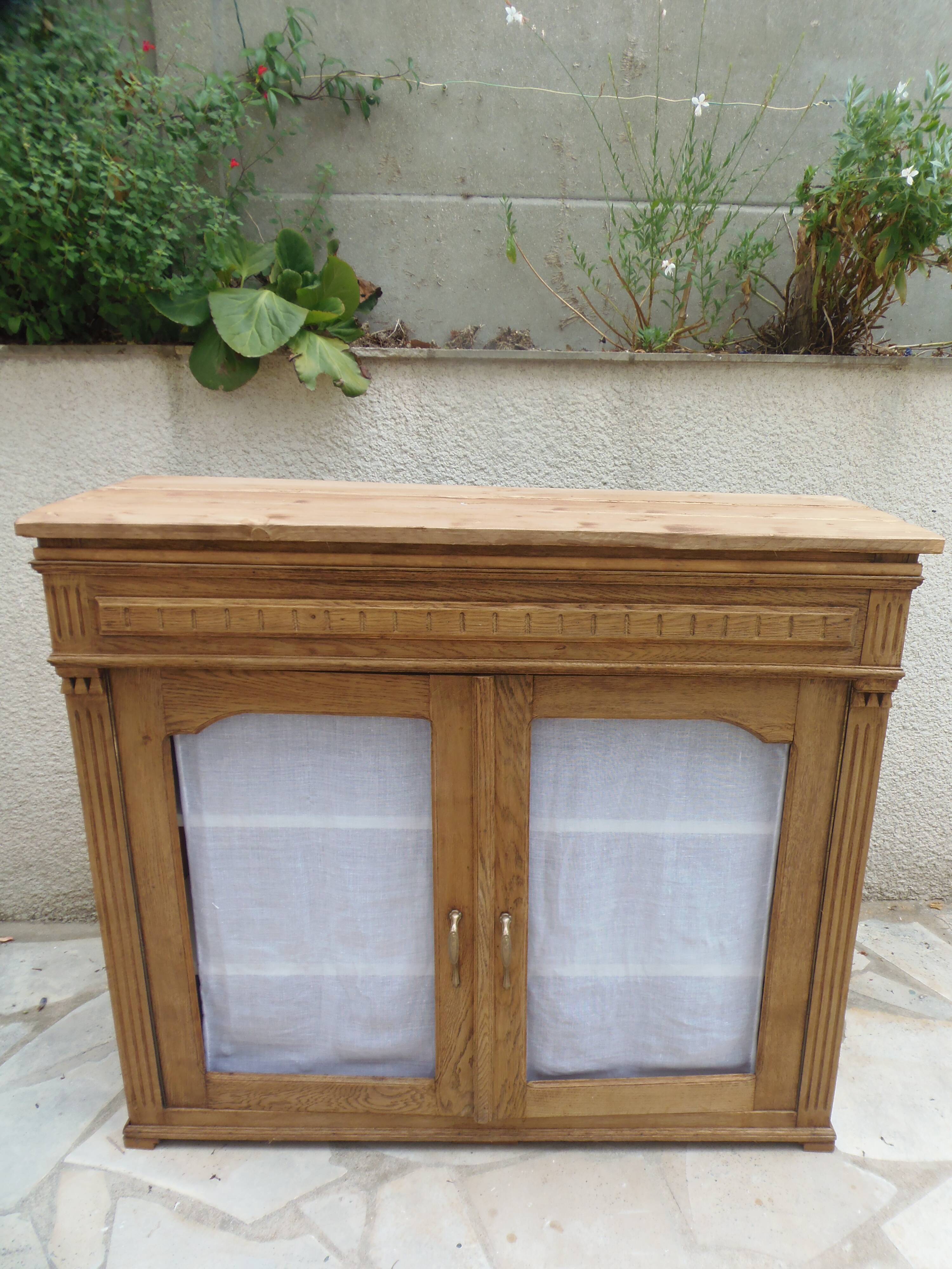 Antique wooden sideboard, fabric doors and pearl grey shelves.