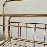 Gilded metal magazine door