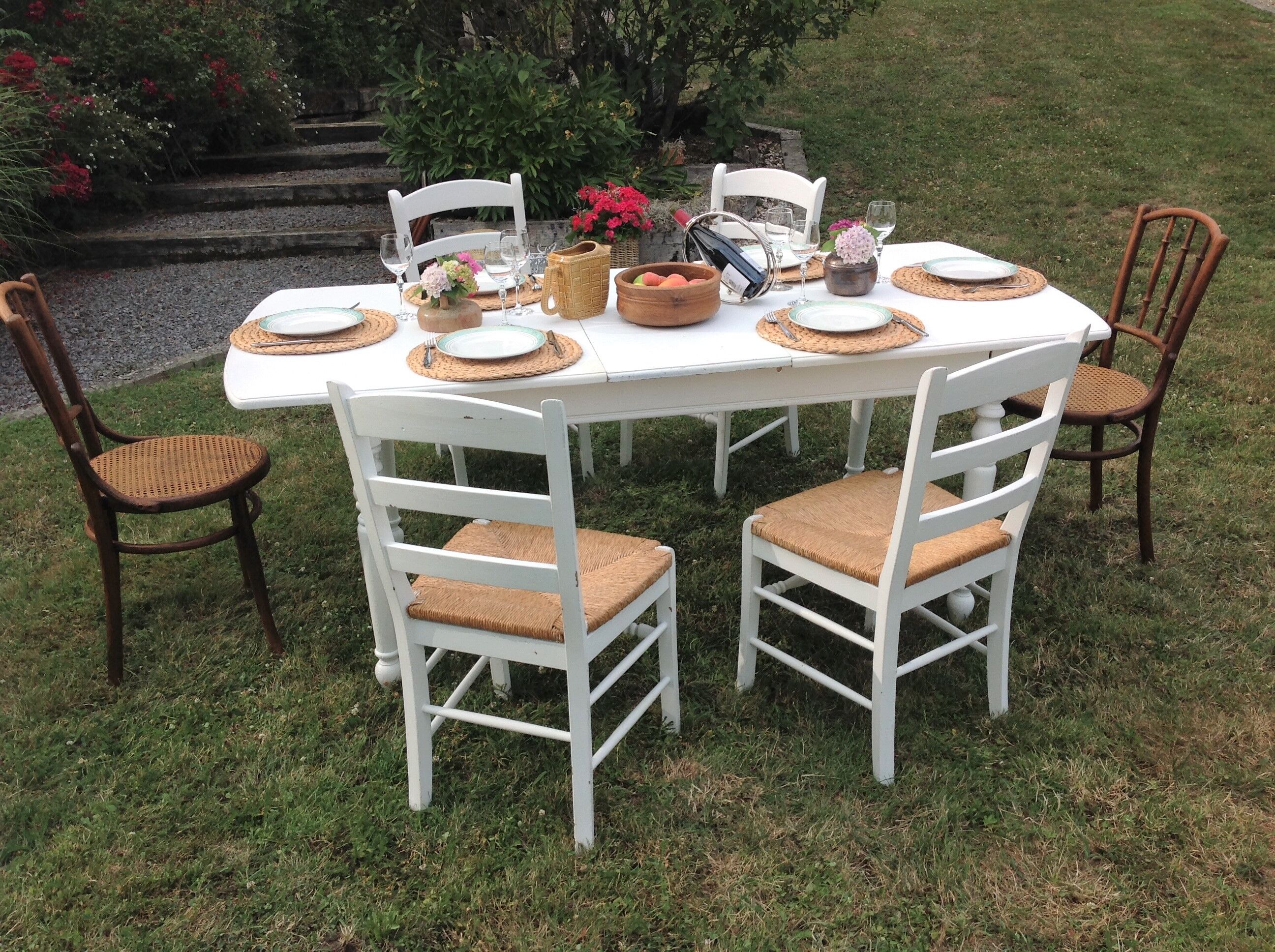 White farmhouse table set and four chairs