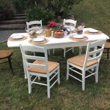 White farmhouse table set and four chairs