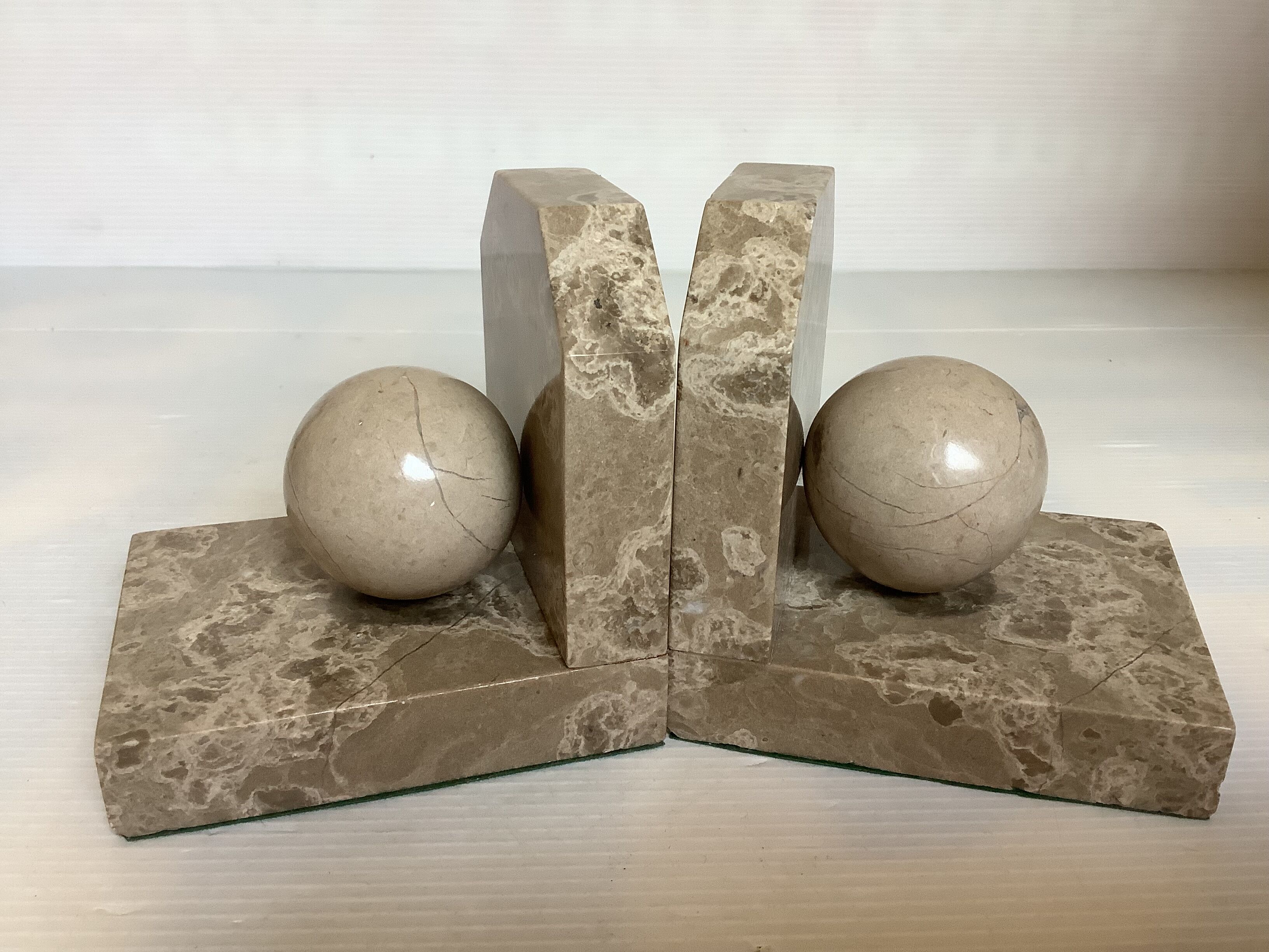 Pair of beige marble bookends.