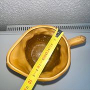 Antique pitcher with flower decoration