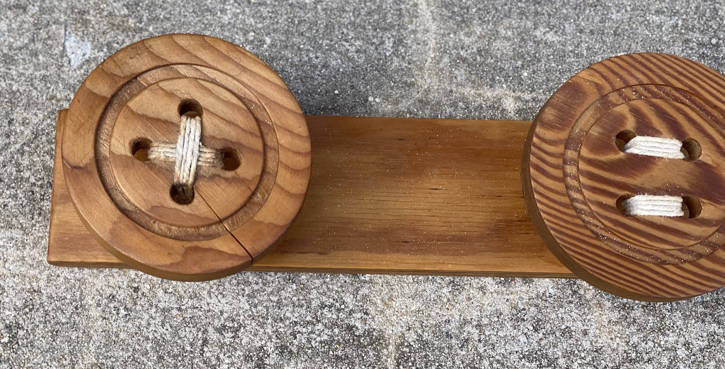 Vintage 1980 coat rack with 3 "button" hooks.