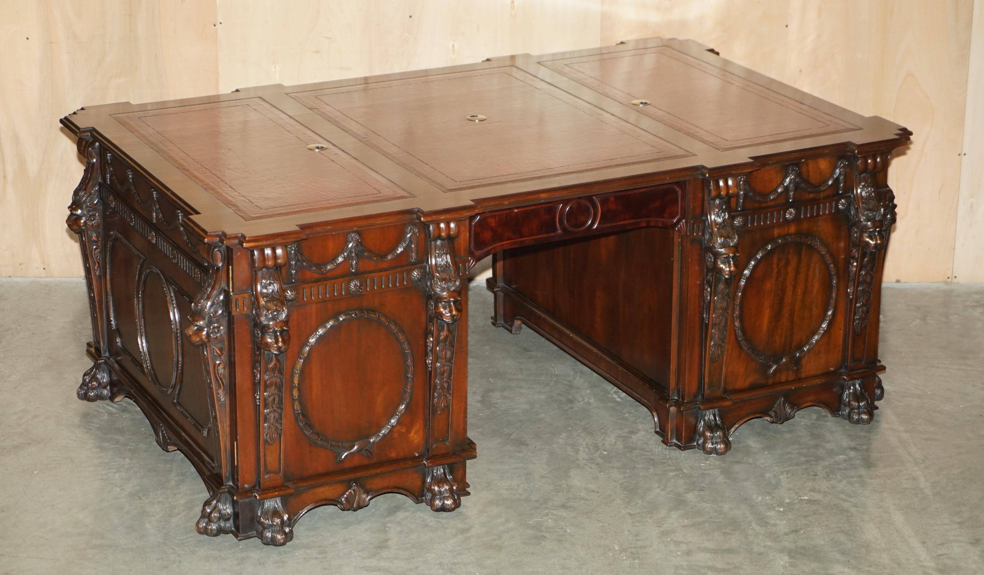 Partner desk with two carved columns featuring lion heads, according to Thomas Chippendale, restored.
