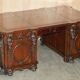 Partner desk with two carved columns featuring lion heads, according to Thomas Chippendale, restored.