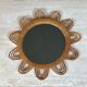 Rattan mirror representing a sun