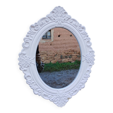 Oval mirror with white frame