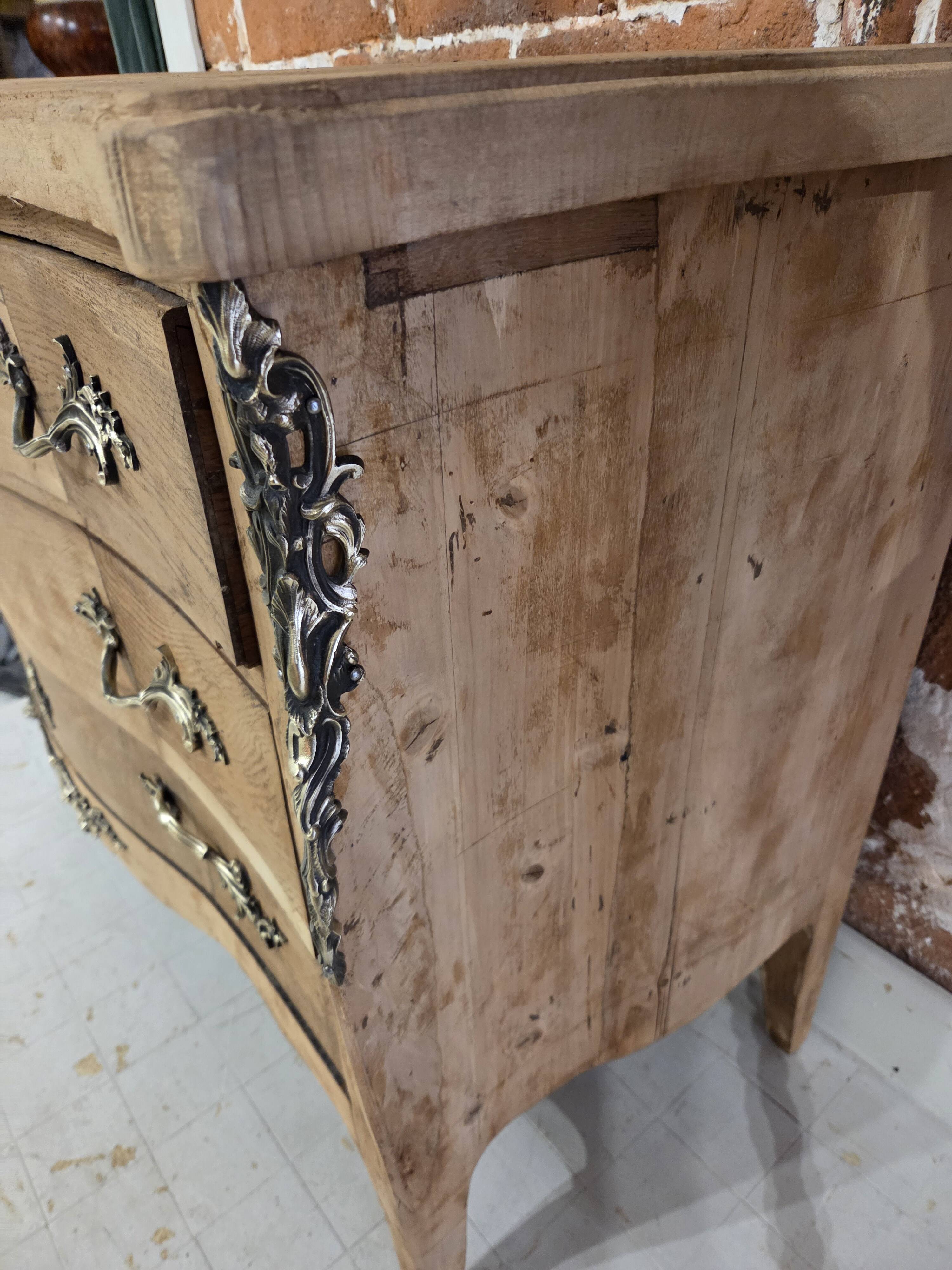 Stripped chest of drawers with bronze handles