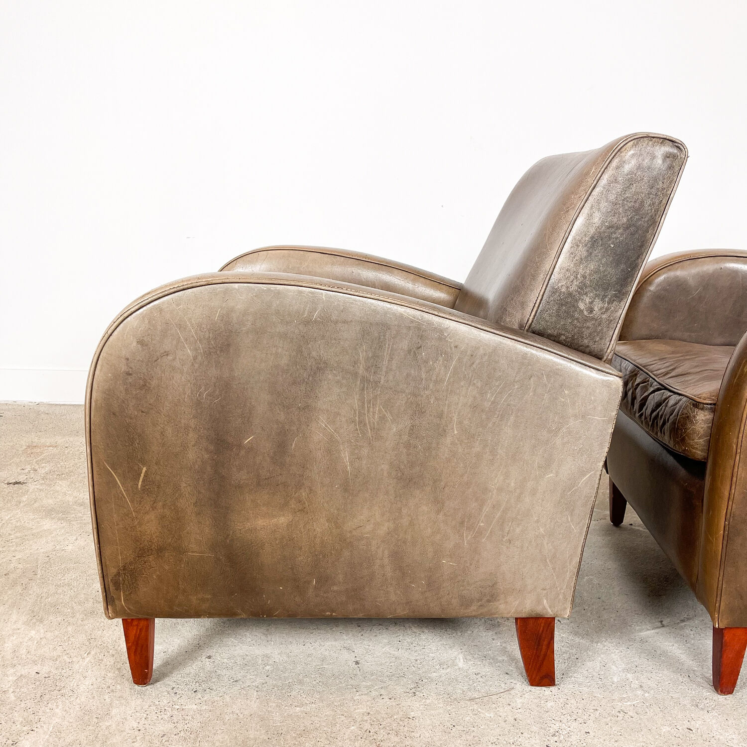 Set of two vintage leather wagon wheel armchairs Haarle