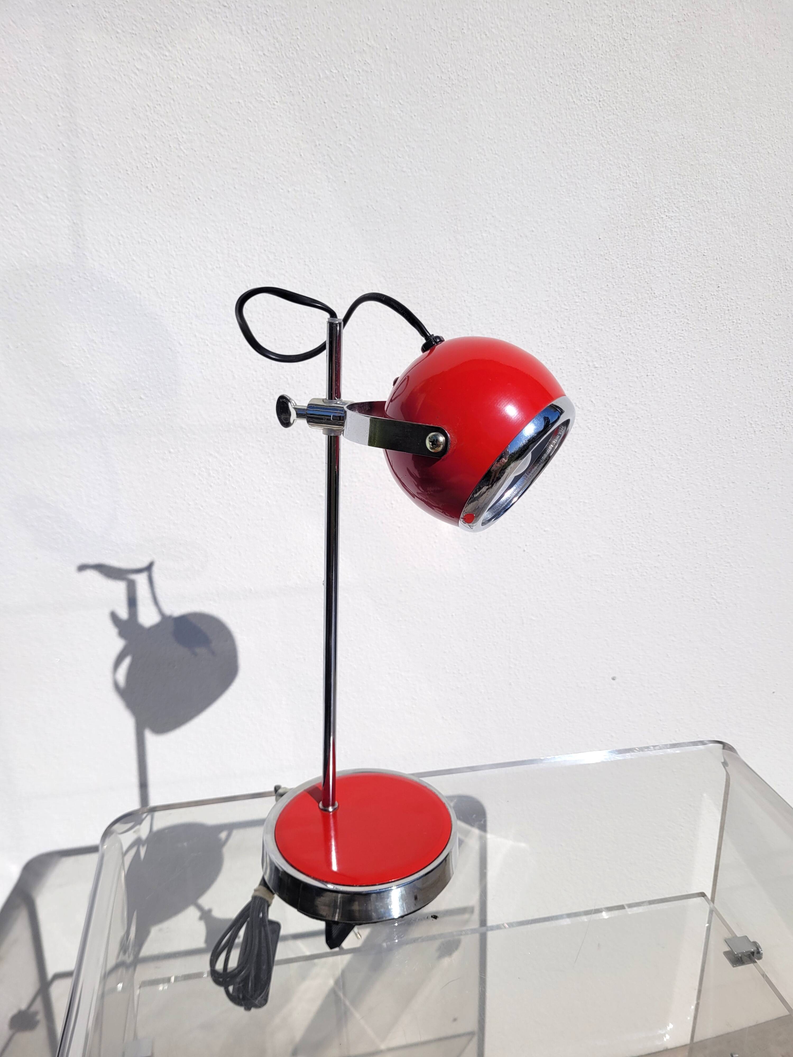 Red and chrome eyeball lamp