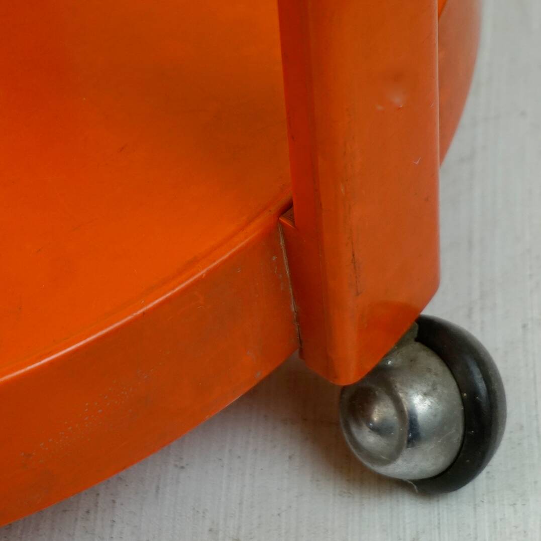 Circular orange Italian Space Age plastic trolley