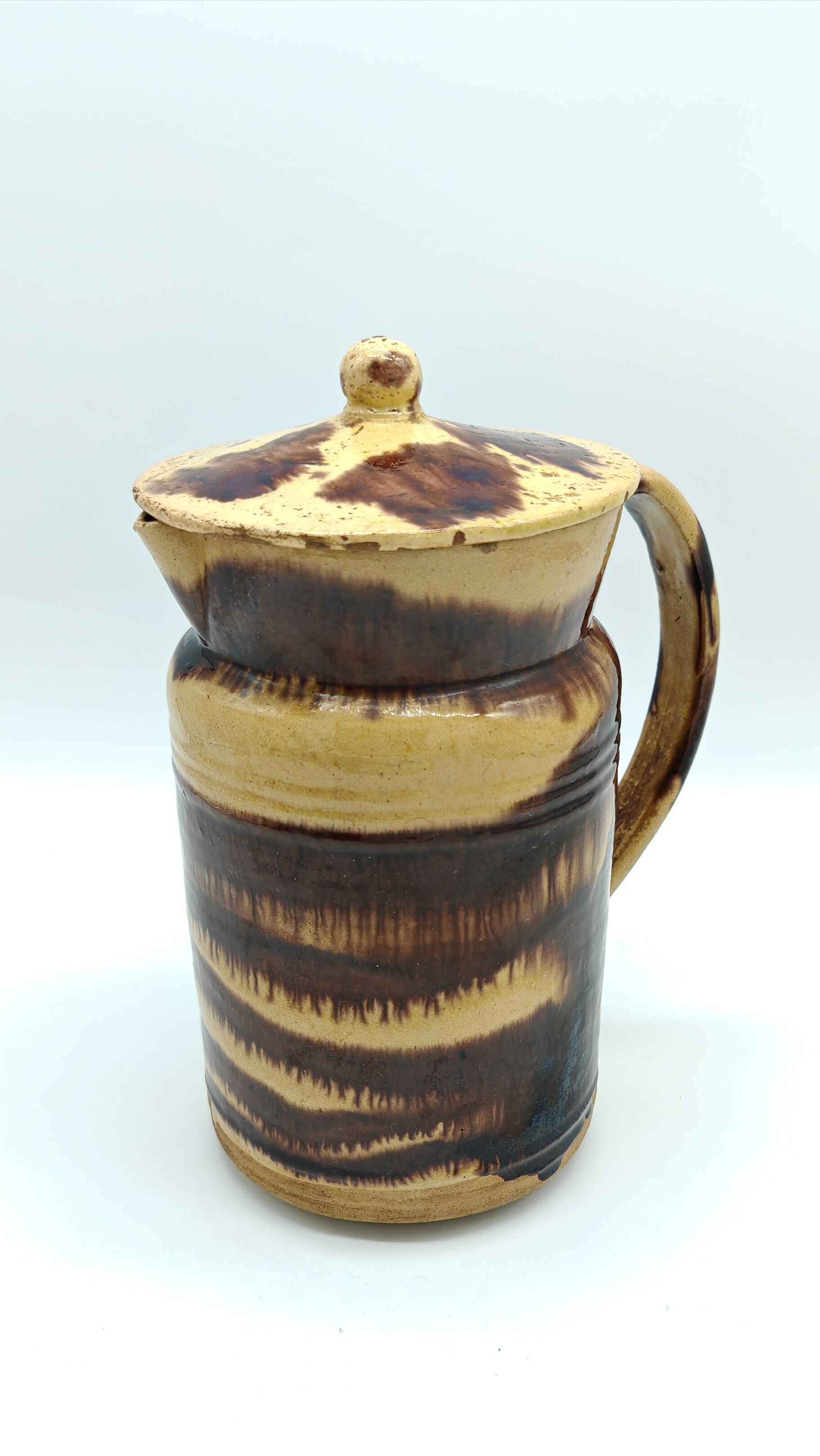 Pitcher covered in glazed earth old french tabby dishes