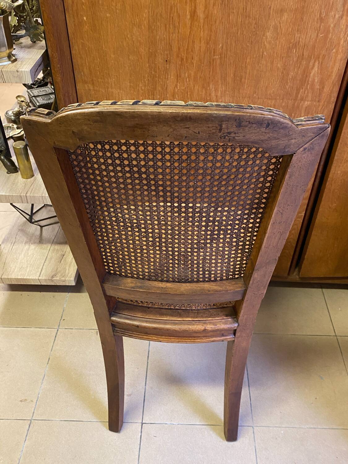 Chair with caned seat and back made of wood