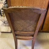 Chair with caned seat and back made of wood
