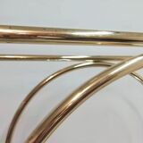 Hollywood Regency brass and glass shelf with elephant heads from the 1970s