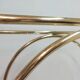 Hollywood Regency brass and glass shelf with elephant heads from the 1970s