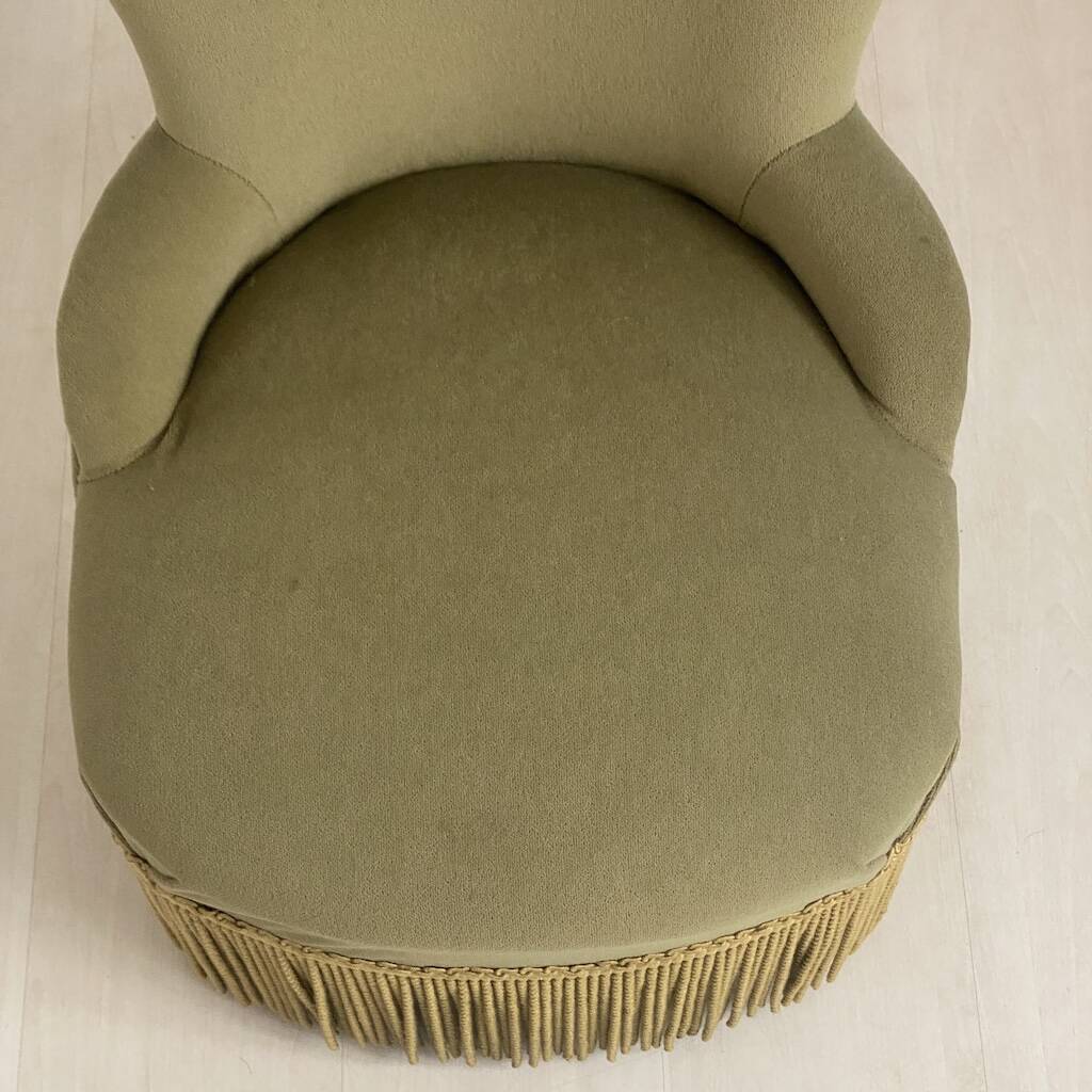 Small green velvet tub chair