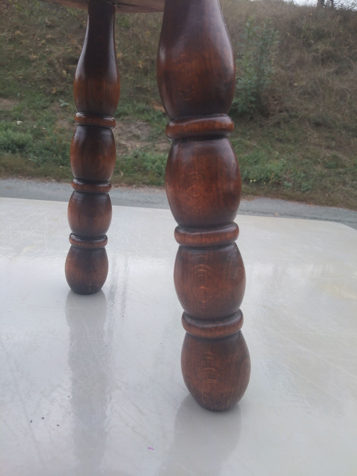 Small vintage tripod stool made of turned wood, in the style of Charles.