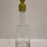 pair of decanters, bottles or jars, made in crystal with a ceramic tap enameled in green color