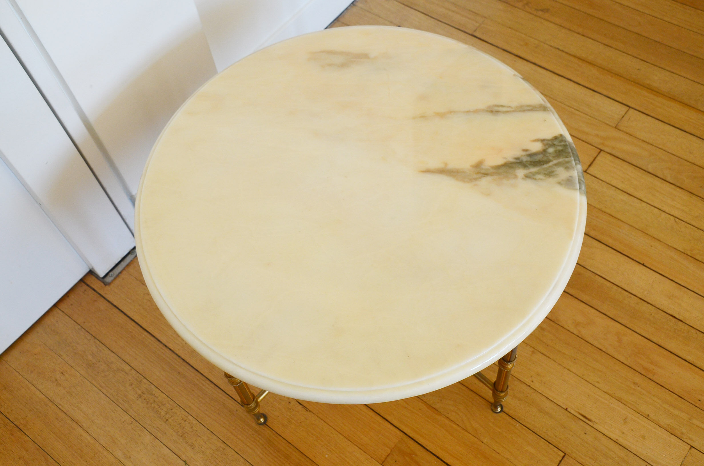 Round coffee table in 1960s neoclassical marble style