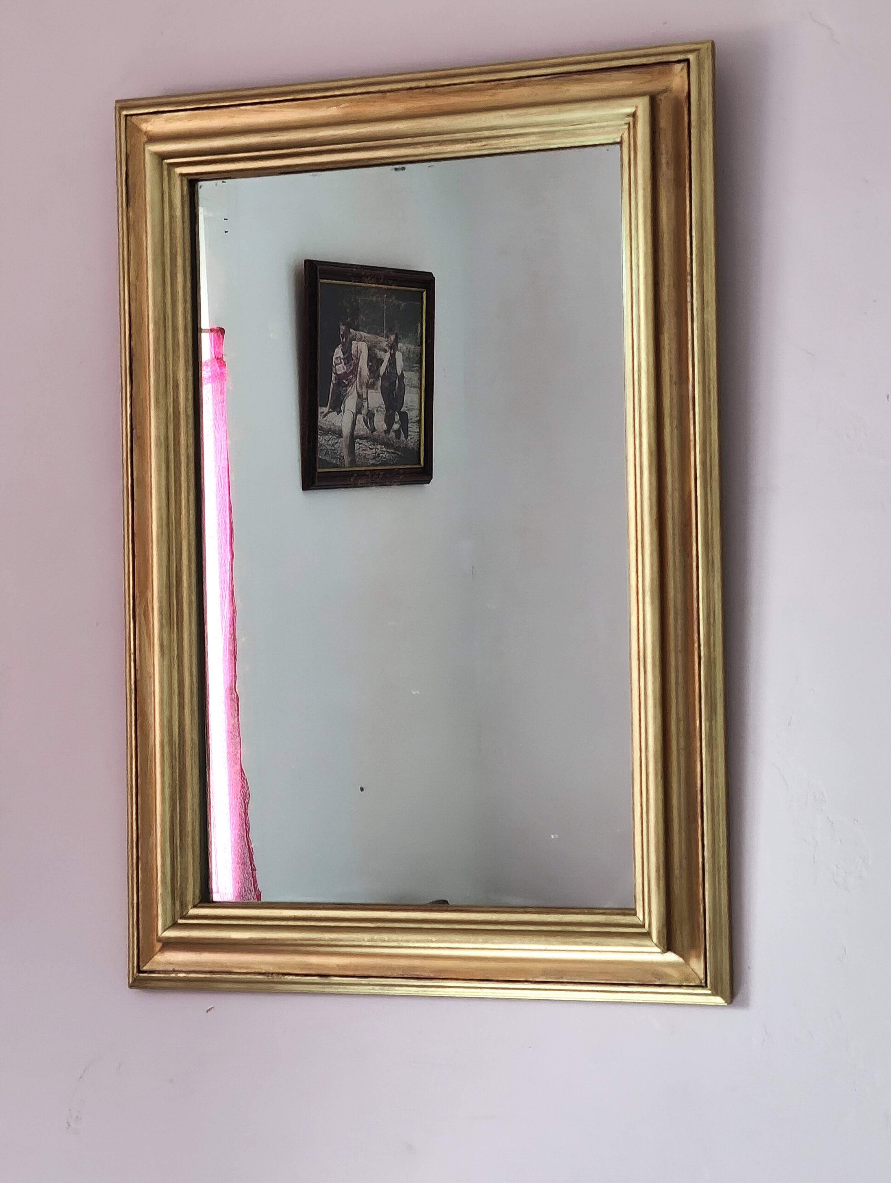 Miroir ancien en bois doré et cuivré