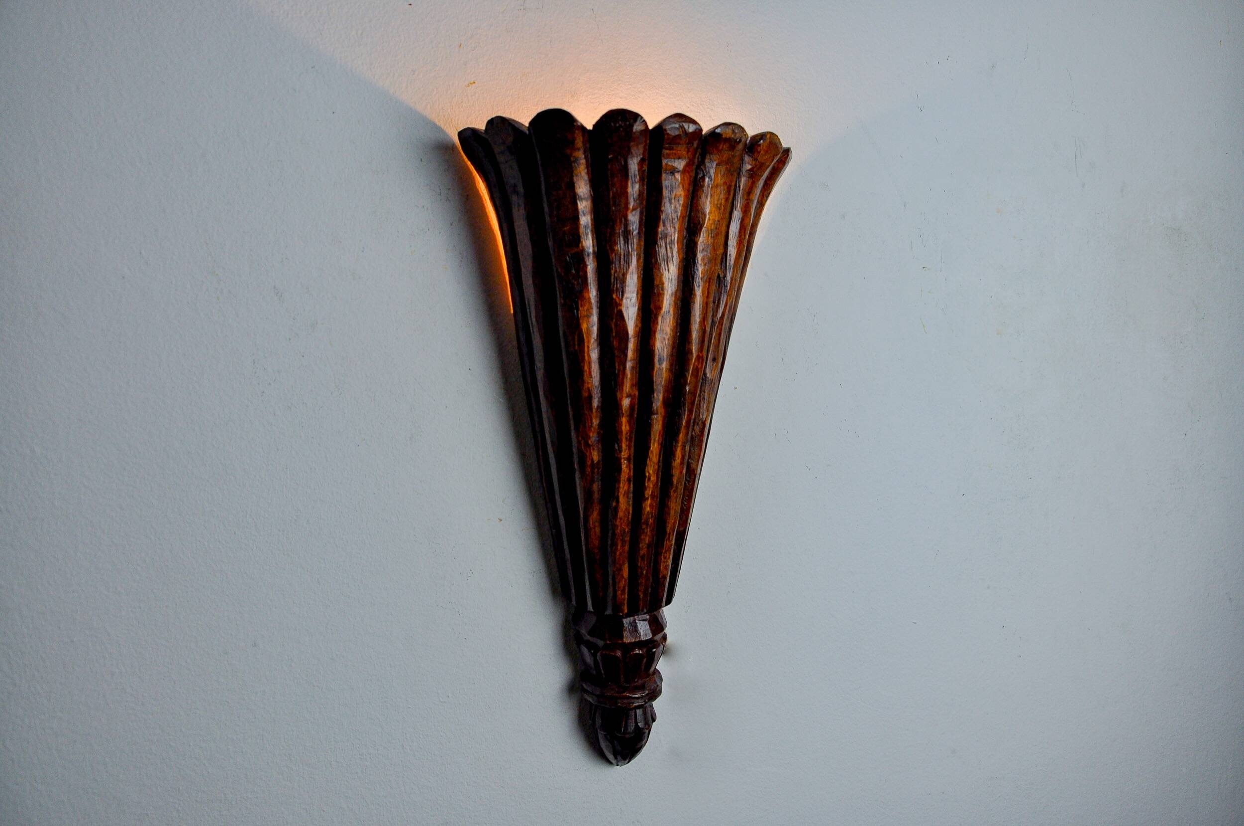 Art Deco wall light in carved wood, France, 1930