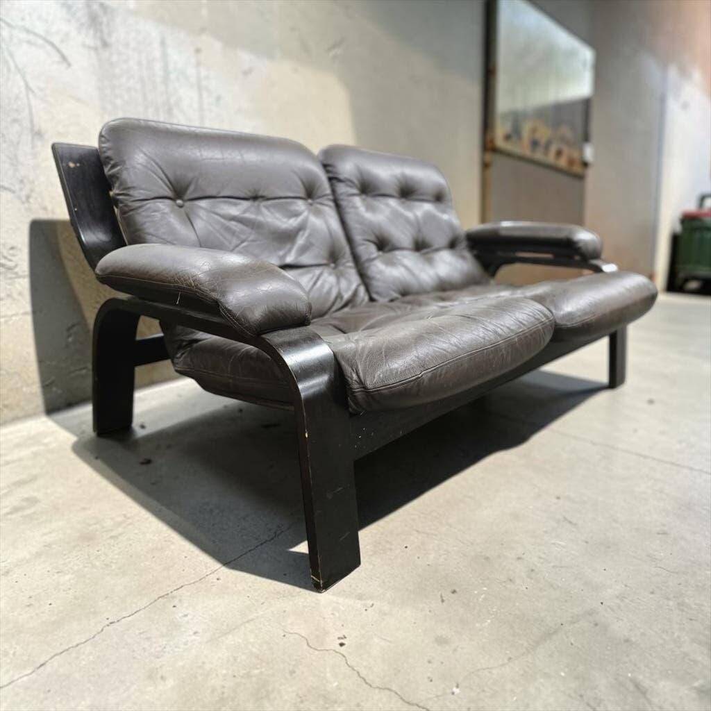 Vintage brown leather two-seater sofa