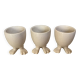 Set of cracked egg cups with feet