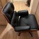 Fauteuil et ottoman Charles Eames en bois de palissandre et cuir