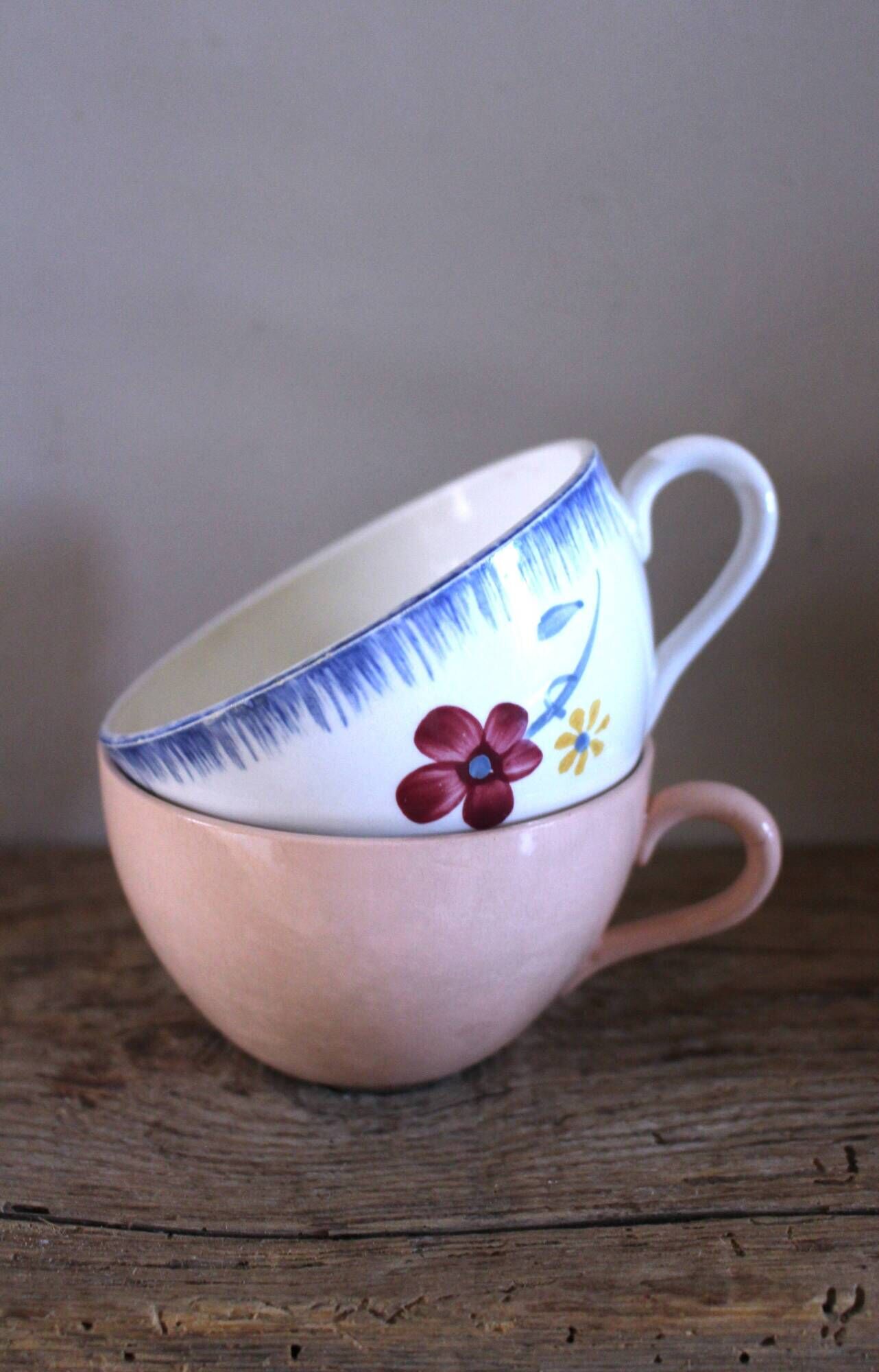 A set of two Digoin Sarreguemines Marylou Rose Art Deco cups.