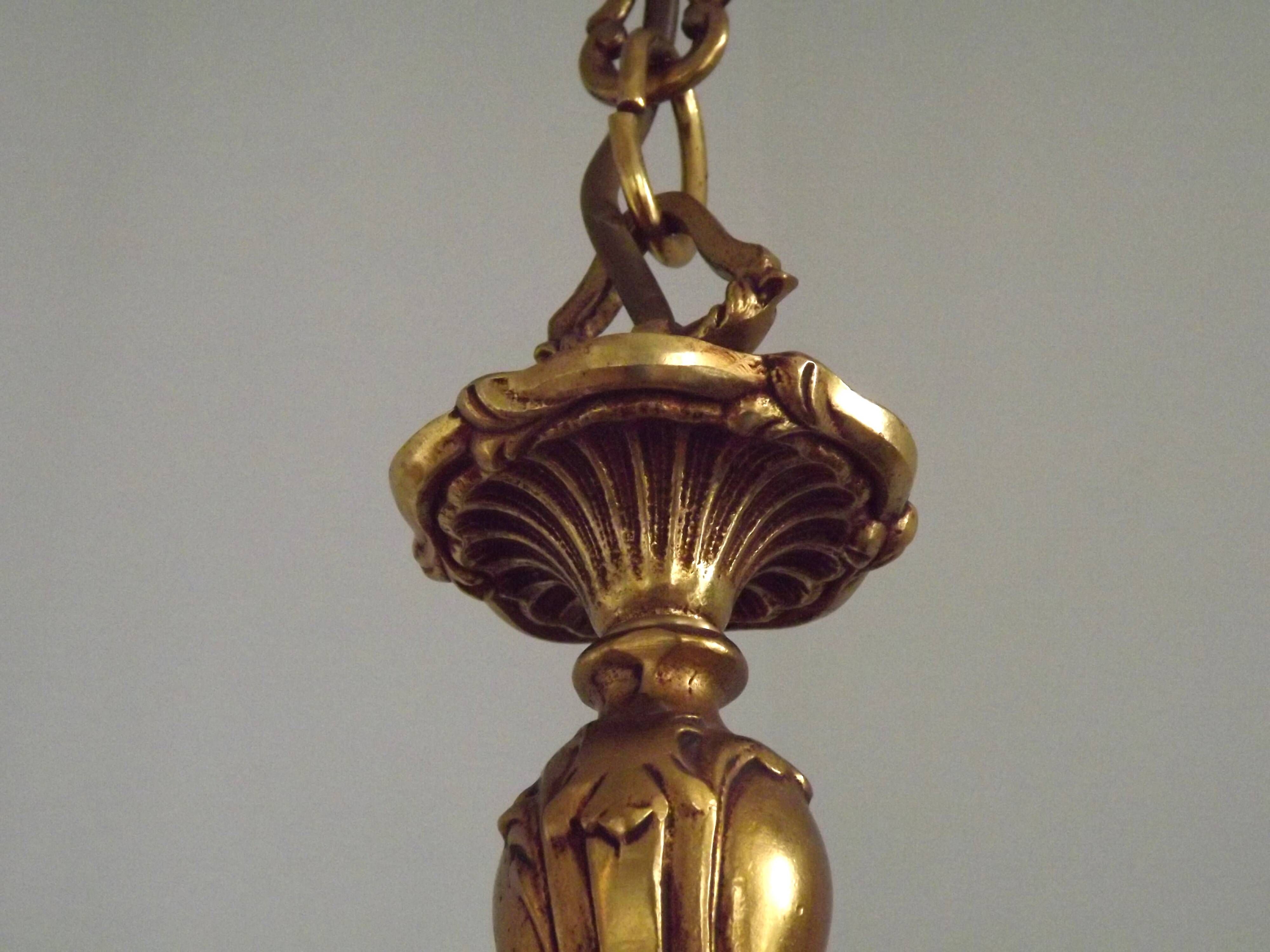 Vintage French traditional style bronze chandelier with 5 lights featuring acanthus leaf details.