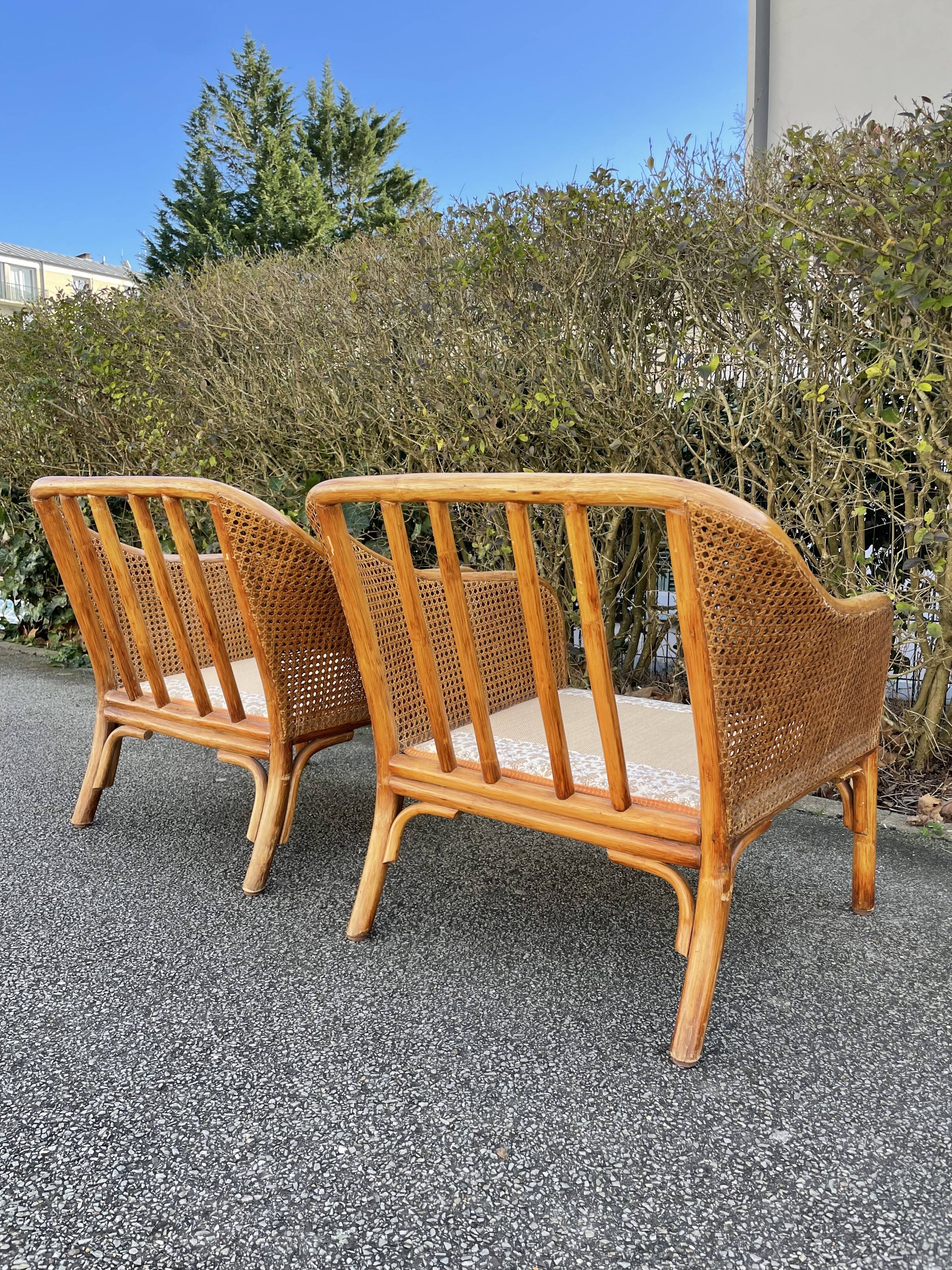 Paire de fauteuils en rotin et cannage