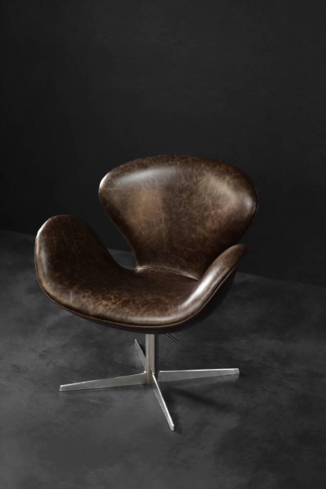 Brown leather Swan chair by Arne Jacobsen, mid-century Danish modernity.