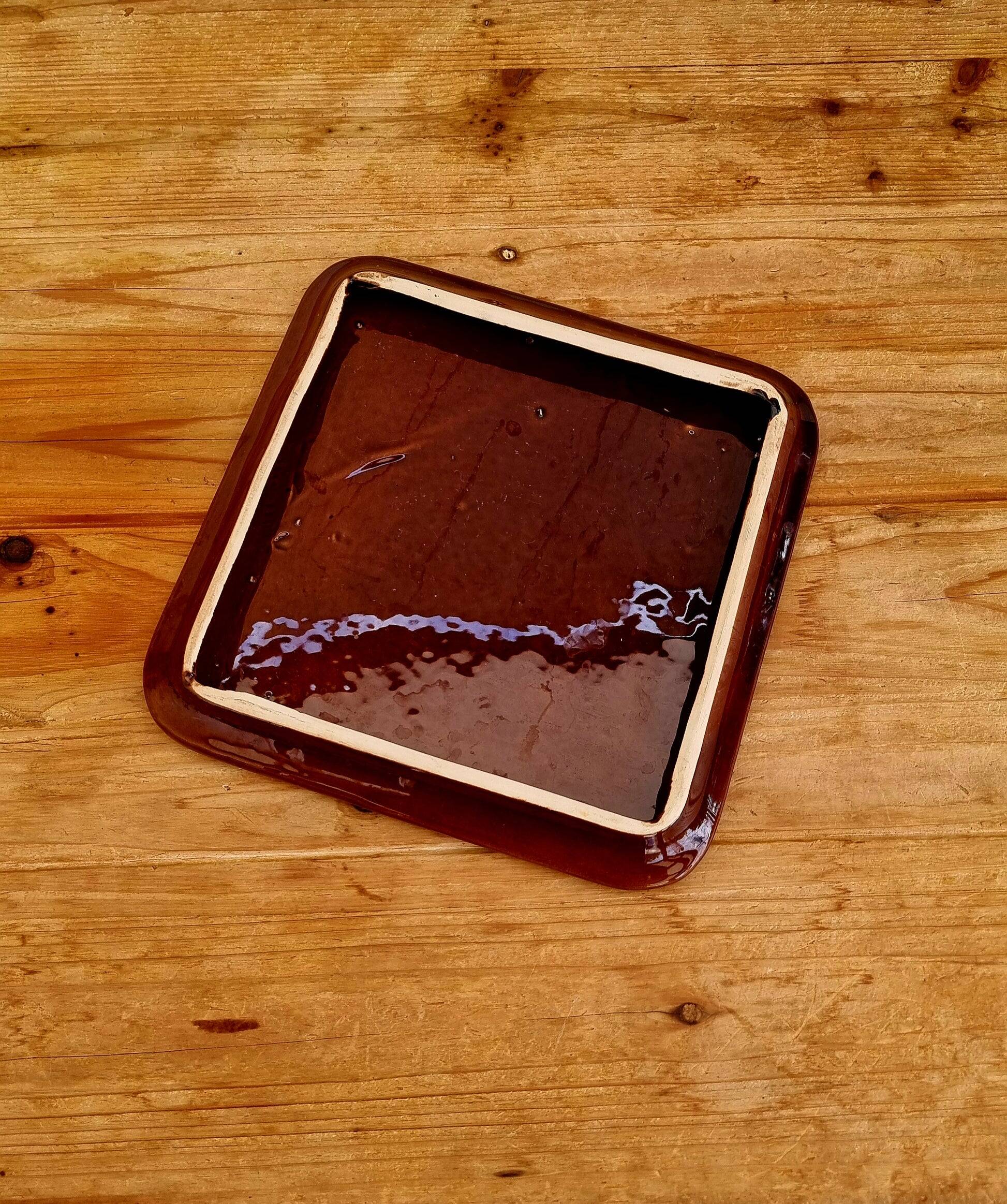 Vintage ceramic trivet with a 70s pattern.