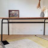 Metal tubular base table with a wooden top.