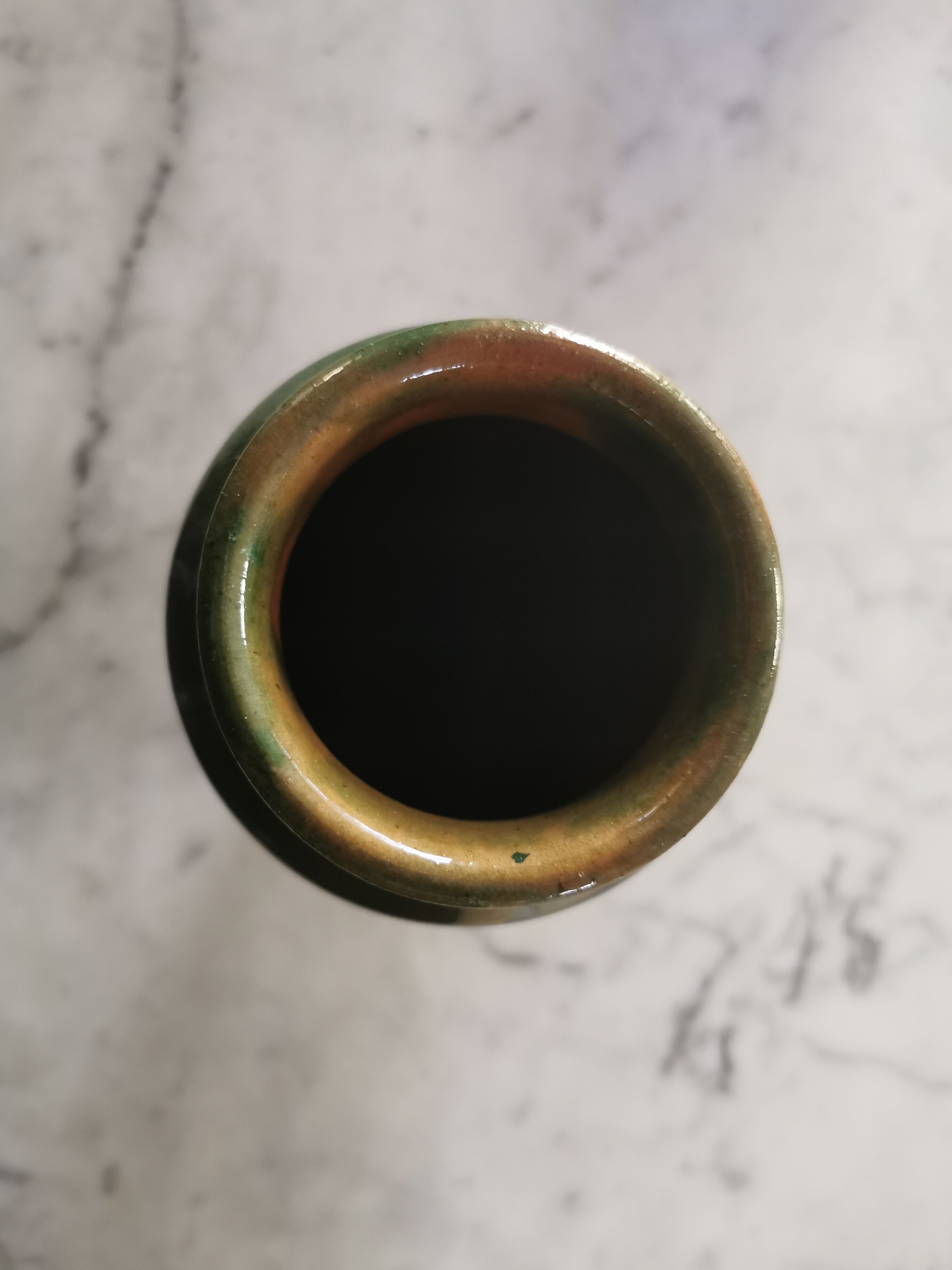 Ancient vase in glazed green terracotta.