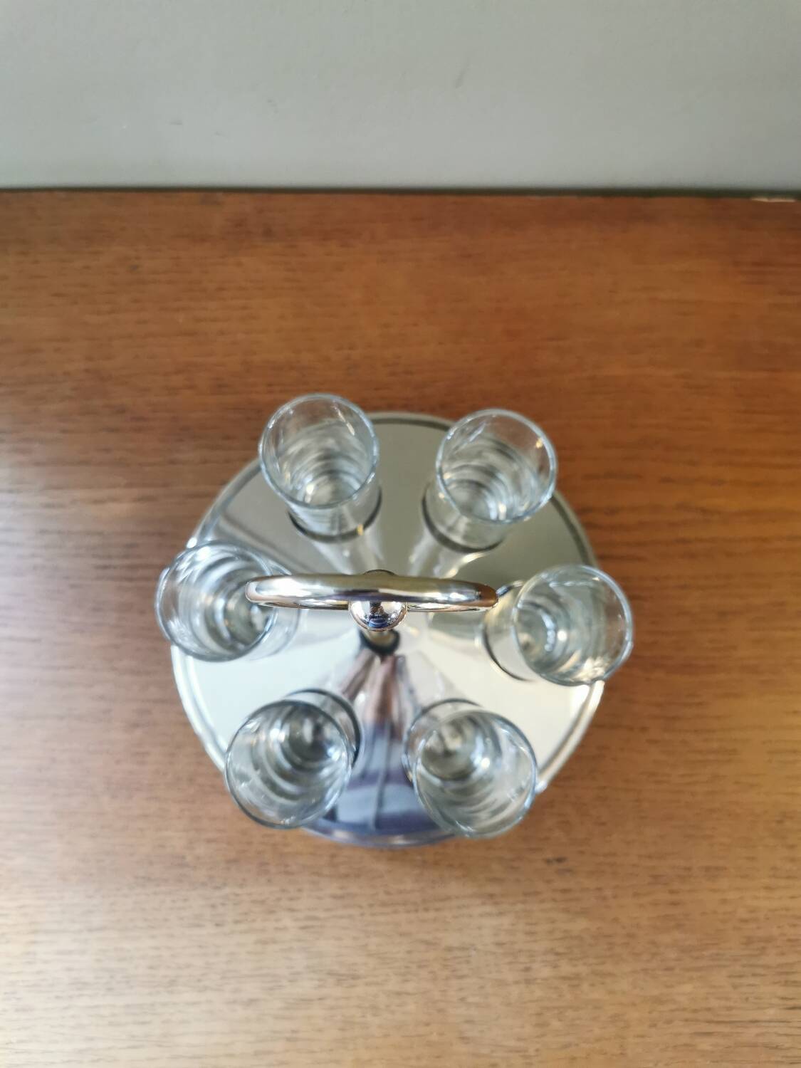 6 shot glasses on vintage metal support