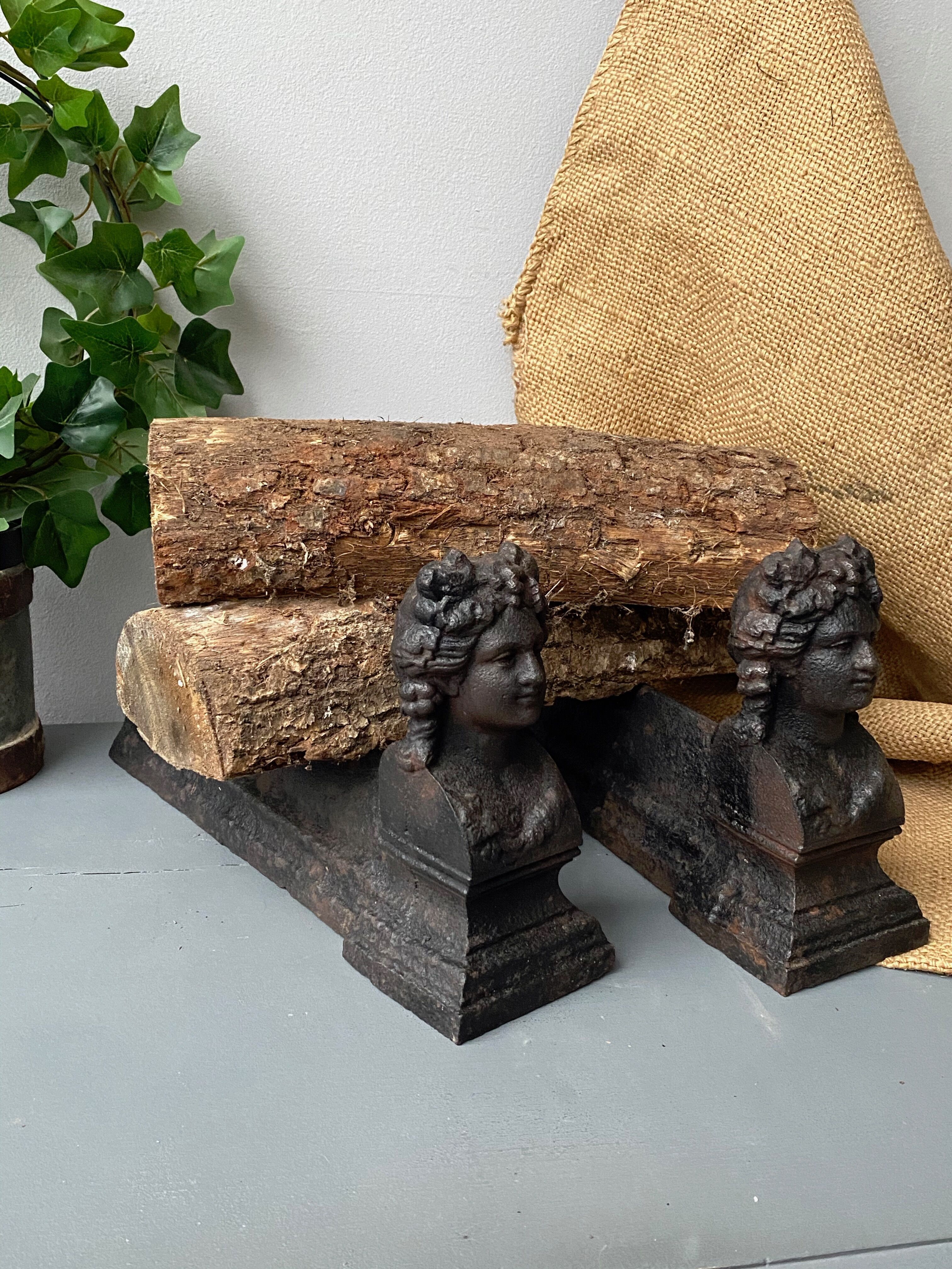 Pair of cast iron pegs