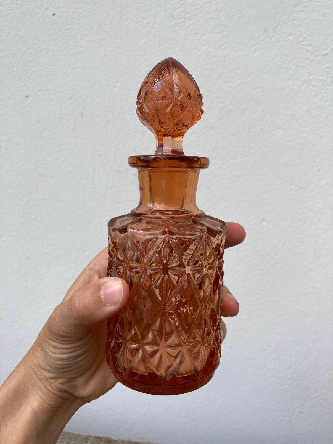 Art Deco perfume bottle in old amber pink glass